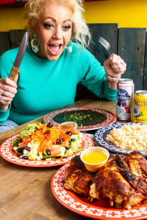 Woman sitting with plates of food Cactus Cafe photography example