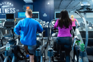 Man and woman on ellipitical