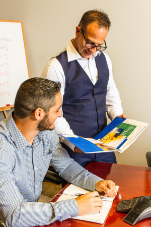 Staff Photo Two men discussing work